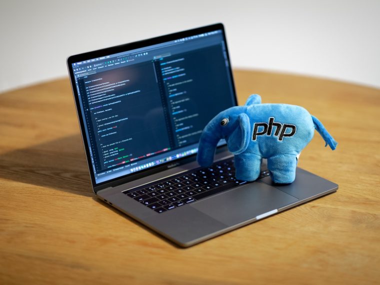 blue elephant figurine on macbook pro